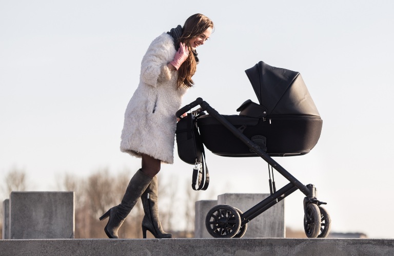 woman pushing stroller