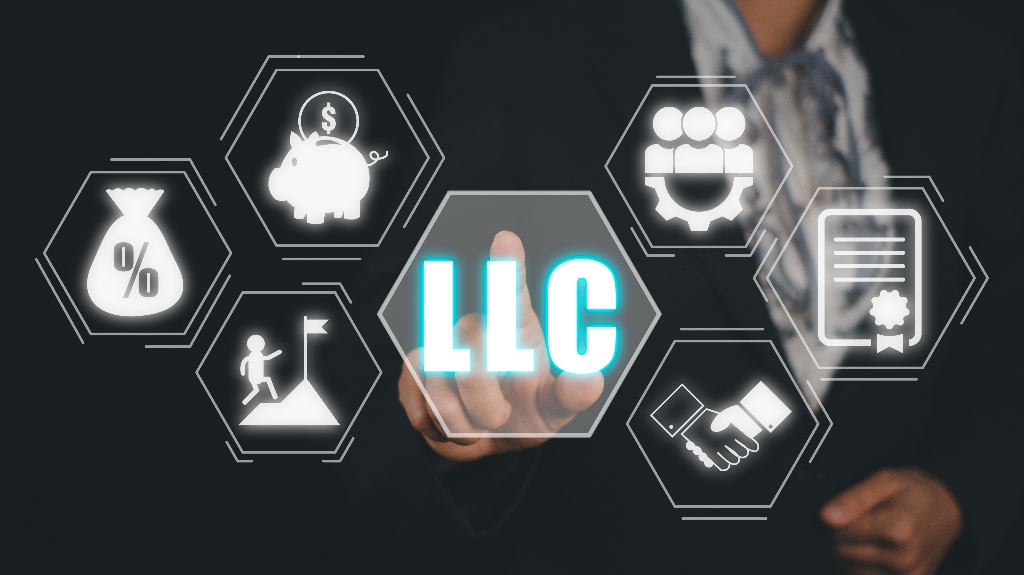 Person hand touching LLC icon on virtual screen