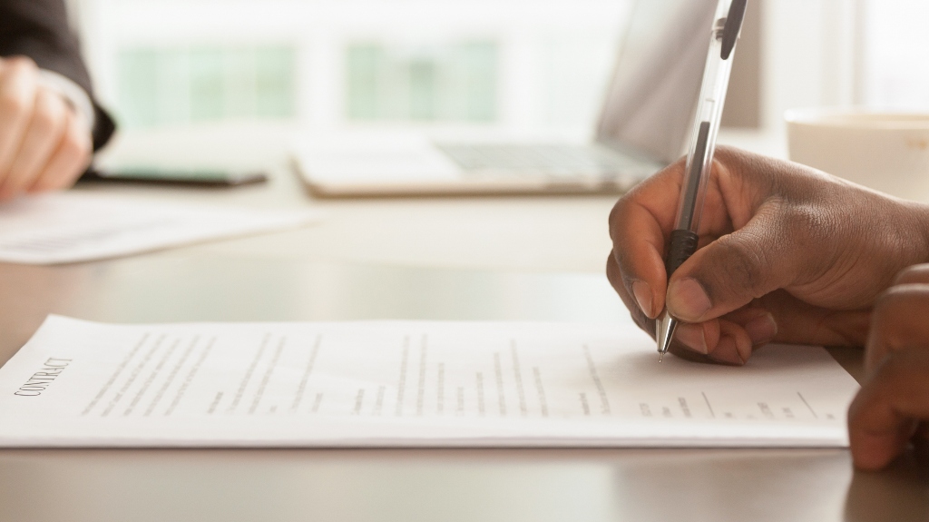 businessman is signing contract