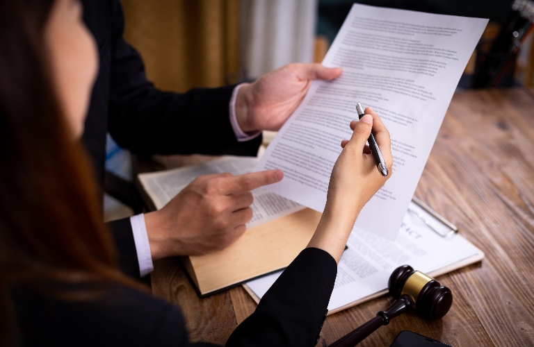 lawyer and client are reviewing contract